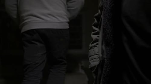 Shadowy Hand Exchange at Night