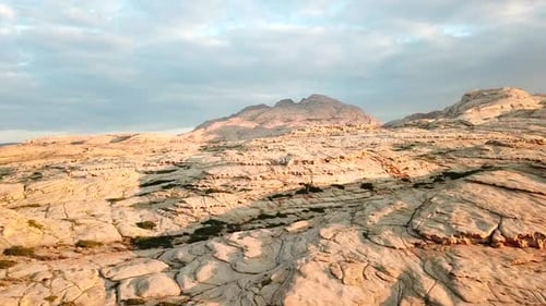 Golden Hour Over Rocky Desert Mountain Landscape