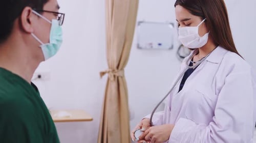 Healthcare Professional Examining Patient with Stethoscope in Clinic