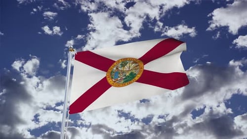 Florida State Flag Waving in Blue Sky with Clouds