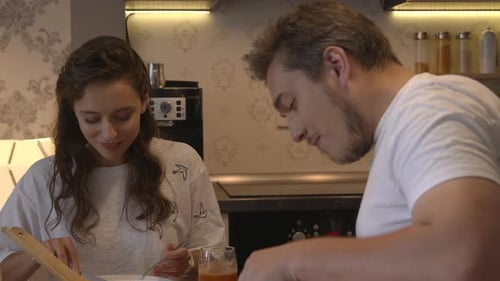 Couple Sharing Healthy Meal Together in Kitchen