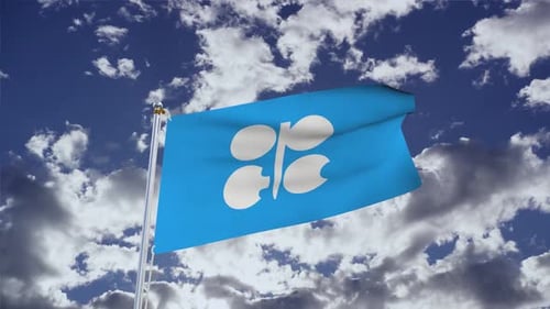 OPEC Flag Waving Against Blue Sky with Clouds