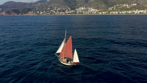 Sailing Yacht Sails to Sea Aerial View 4 K