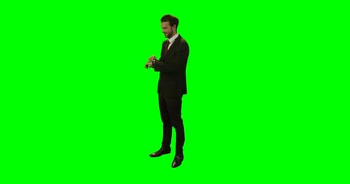 Smiling businessman using smartwatch