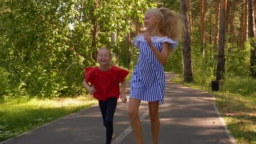 Couple Joyful Girls Run Park Summertime Background
