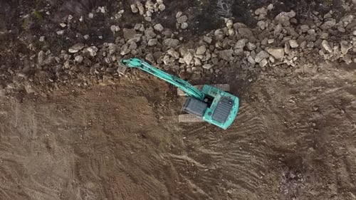 Excavator Working in a Rural Environment from Above