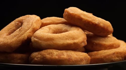 Pile of Freshly Made Golden Brown Donuts