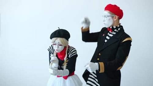 Comical Mimes Performing on a White Background