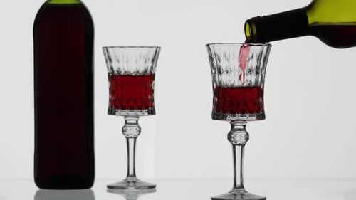 Red Wine Poured into Crystal Glassware