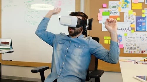 Man Using Virtual Reality Headset in Office