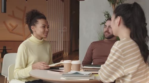 Diverse Friends Chatting in Restaurant