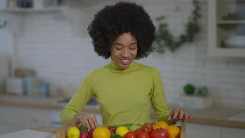 Woman with Fresh Vegetables in Bright Kitchen