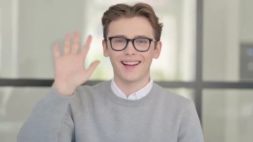Portrait of Young Man Waving Welcoming