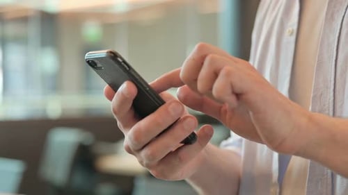 Close Up of Man Using Smartphone