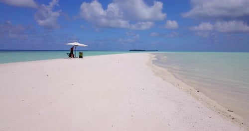 Happy couple on honeymoon vacation spend quality time on beach on sunny white sandy 4K background