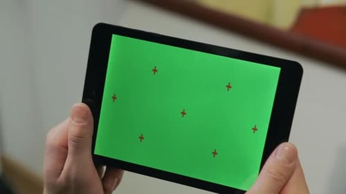 Man Holding s Tablet with Chroma Key Screen. Man Using Tablet with Green Screen