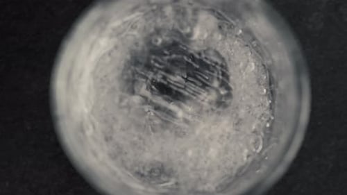 Ice Cubes Falling Into Sparkling Water Close Up