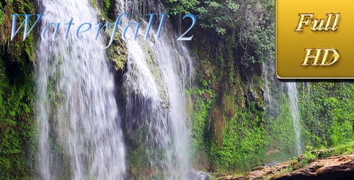 Tropical Waterfall Cascading Over Mossy Rocks