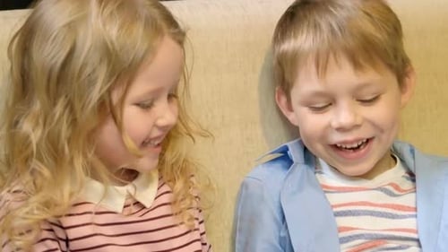 Kids Laughing Together Sharing an Apple