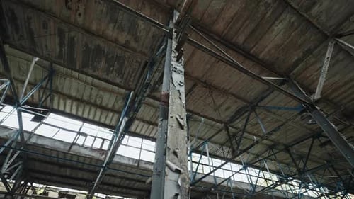 Burned Roof of Damaged Industrial Warehouse Inside