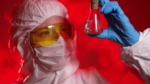 Nurse Closing a Sample Tube Testing for Presence of Coronavirus