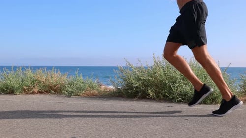 Athletic Man Exercising At The Beach