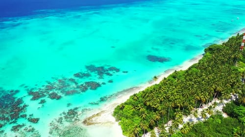 Natural above travel shot of a white sand paradise beach and blue water background in hi res 4K
