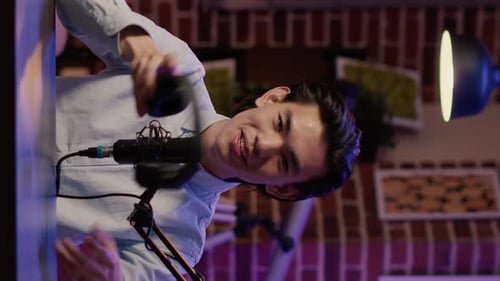 Man Puts on Headphones in Broadcasting Studio, Close Up