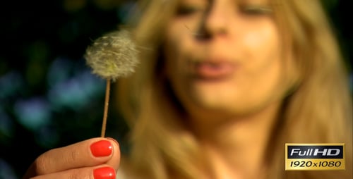 Fair-Haired Woman Blowing Dandelion Seeds