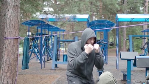 Shadowfight - Boxing Fighter Workout in Public Park on Workout Ground.