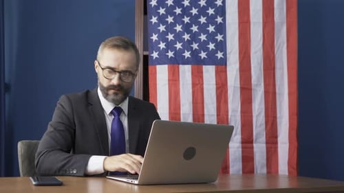 Man in Suit Reacting Angrily to News on Phone