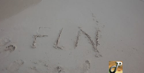Text Written in Sand Washed Away by Wave