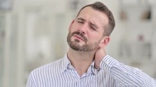Man Rubbing Neck Experiencing Pain
