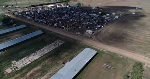 Drone flight over midwest scrapyard. 4k 60fps.