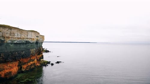 Drone Is Flying Along Amazing Eroded Rocky Sandstone Sea Shore Above Amazing Calm Sea Bay