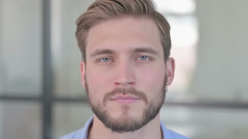 Close Up of Face of Serious Creative Man Looking at Camera