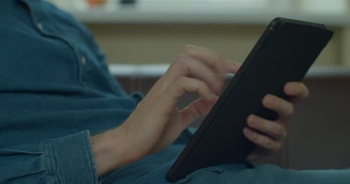 Hands of Young Man Using TabletPC at Home Office. Communication, Online Shopping, Chat, Social