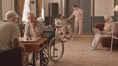 Seniors Playing Chess in Assisted Living Facility
