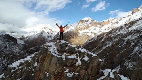 Hiker Mountain Peak In Snowy With Freedom