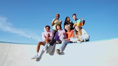 Friends Posing at Skate Park on Sunny Day