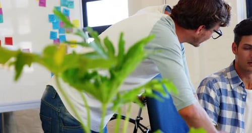 Young Adults Working Together Collaboratively in an Office