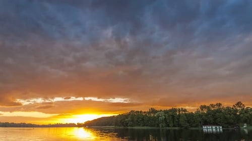 Stunning sunset over the lake in summer, timelapse, 4K