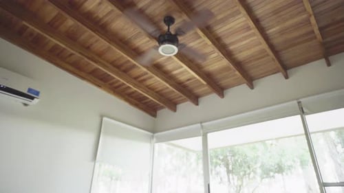 Bedroom Interior with Wooden Ceiling and Fan