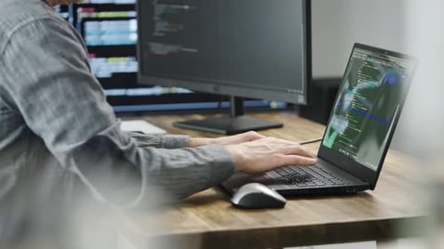 Unrecognizable Programmer Developer Writes Code