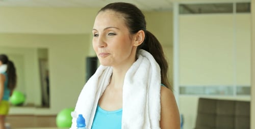 Fit Woman Drinks Water After Gym Workout
