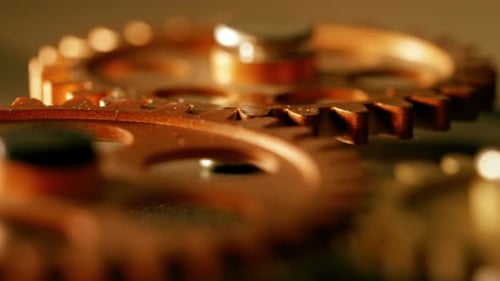 clock's mecahanical wheels rolling-close up