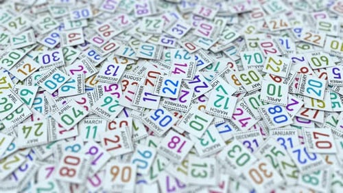 Flying Calendar Pages Revealing a Date