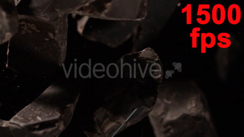 Tumbling Pieces of Dark Obsidian Rock