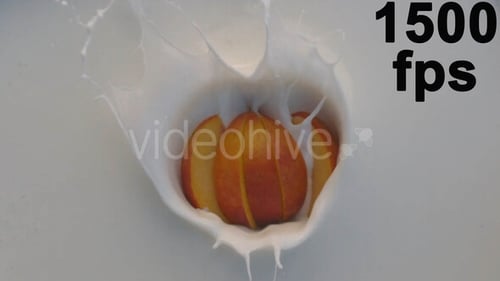 Sliced Peach Falling Into Milk, Creating Splash
