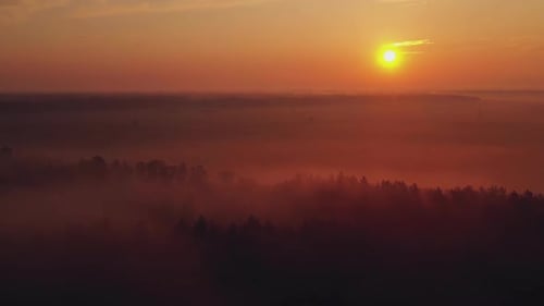 Beautiful Sunrise Over the Fields with Fog